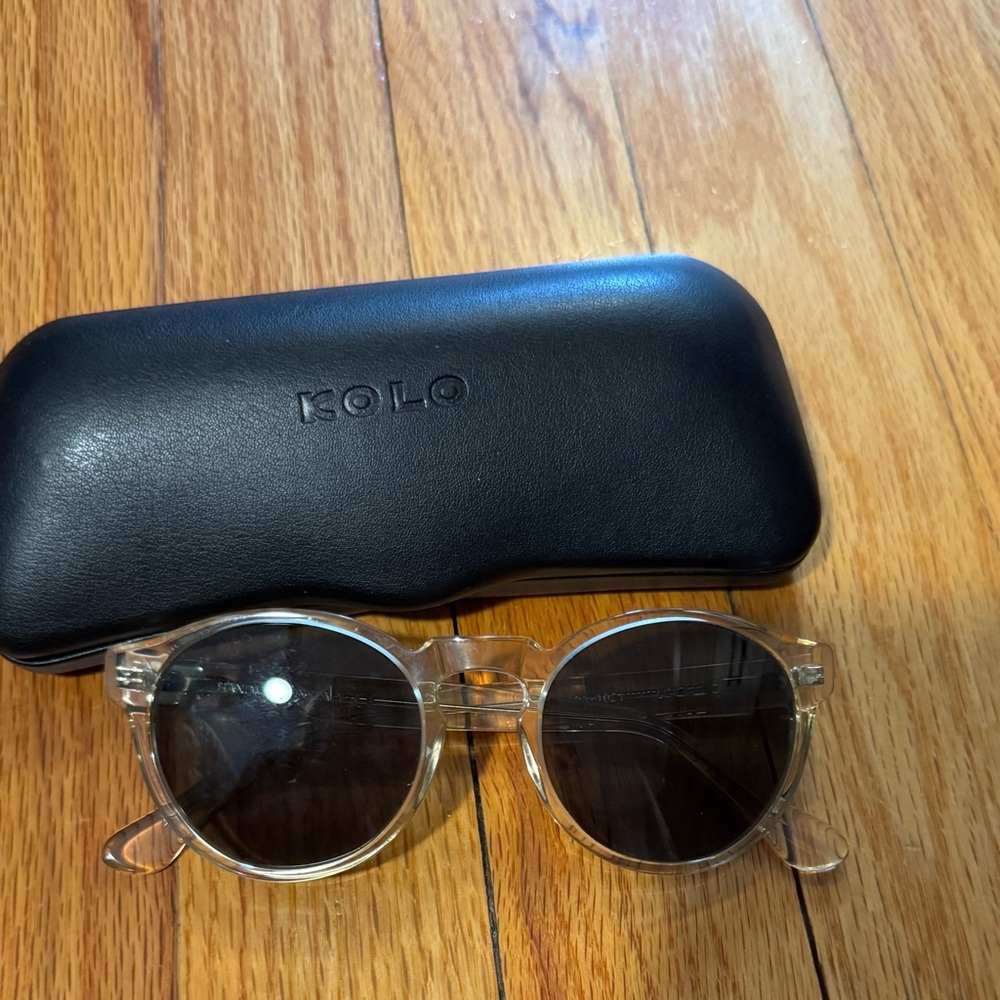 Unisex KOLO sunglasses with clear (vaguely yellow tint) frames.